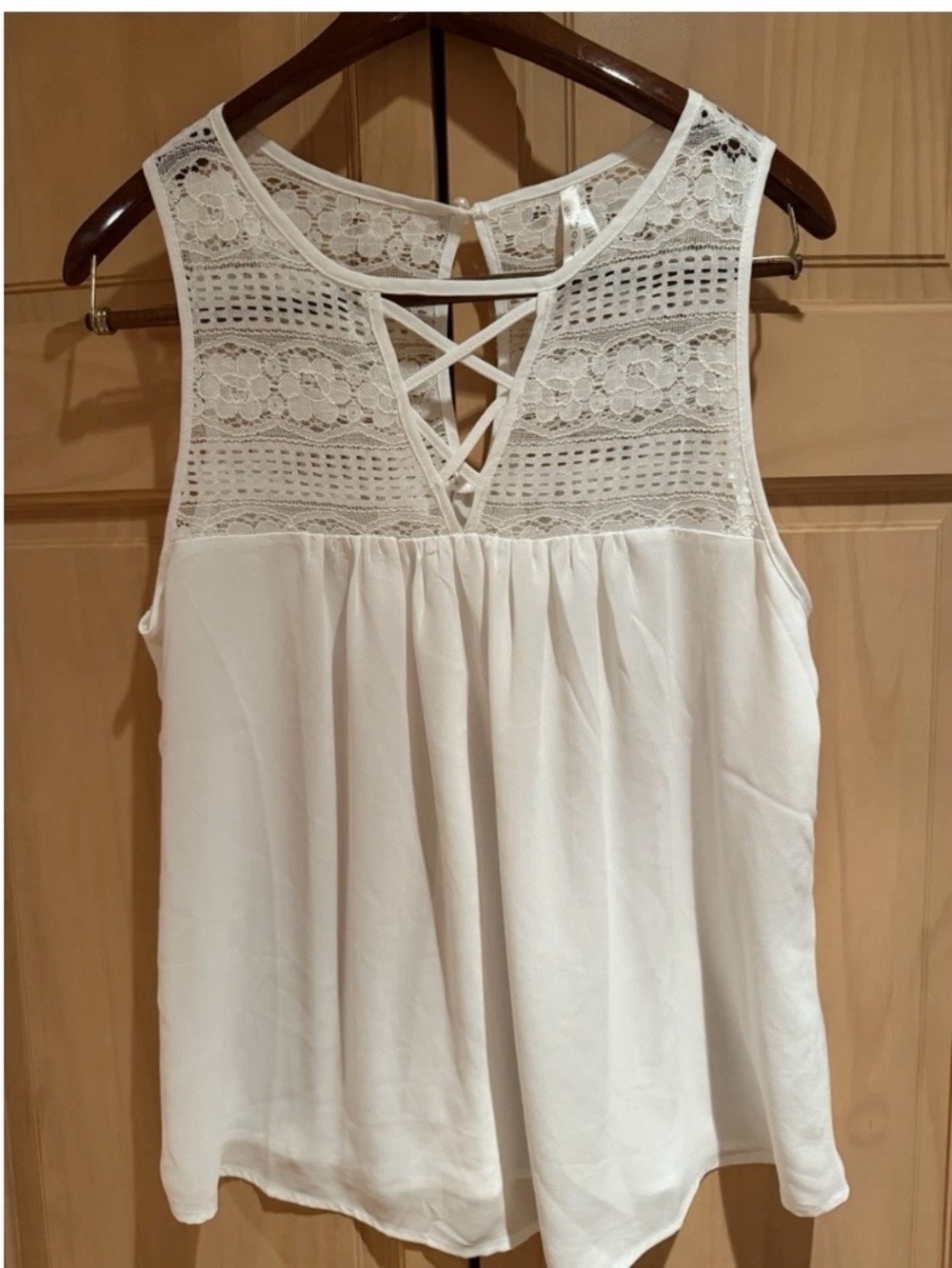 Sleeveless nwot size large crisscross lace up cream color top